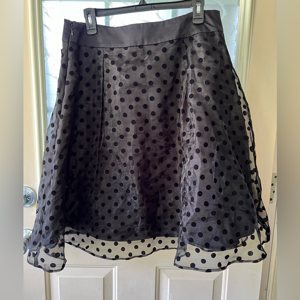 Elle size 14 polka dot organza over black satin. Waist is also satin and bow.